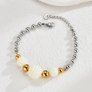 Minimalist stainless steel bracelet featuring mixed gold and silver beads with white pearls