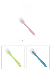 Detailed view of pink, green and blue silicone spatulas with integrated hanging holes
