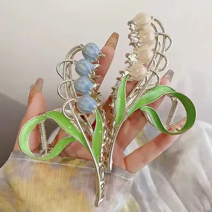 Floral lily of the valley hair claws in blue and cream with hand-painted oil finish