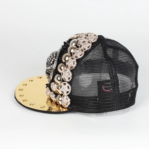 Detailed side view of street style baseball cap with gold star studs and metal rivets
