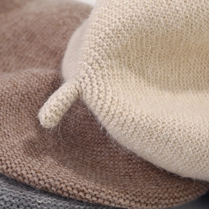 Detailed close-up of knit beret top detail and soft fuzzy texture of rabbit hair blend