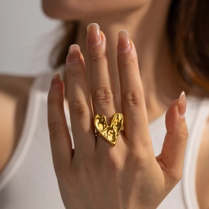 Hand modeling a 18K gold plated stainless steel heart ring with lava hammer texture