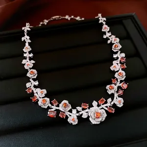 Vintage rose pendant necklace with orange zircon stones and white crystals on black leather