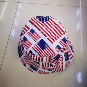 Flat lay of double-sided American flag bucket hat for men and women on tile floor