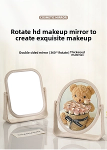 Detail of double-sided 360 degree rotating makeup mirror on marble countertop surface
