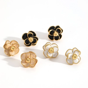French vintage camellia flower stud earrings in black, white, and beige enamel