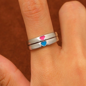 Luminous heart couple rings in polished silver metal shown worn on fingers