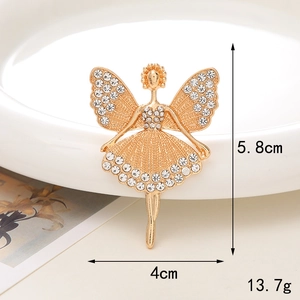 Detailed view showing dimensions of golden ballerina brooch with white rhinestones