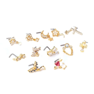 Collection of 13 gold titanium steel nose studs with assorted zircon crystal shapes