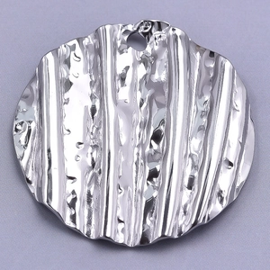 Close-up of 304 stainless steel round pendant with vertical pleated texture and silver finish