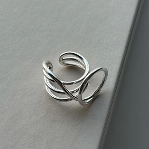 Close-up of polished silver multi-layer line ring featuring a minimalist design
