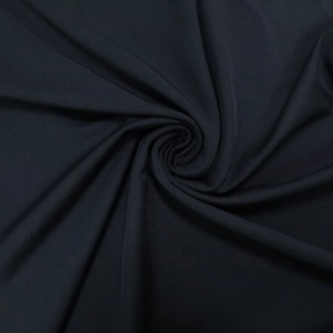 Detailed view of the smooth black elastic fabric texture and fine knitted material