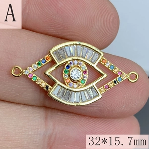 Detail view of gold evil eye charm with colorful zircons, size 32x15.7mm for DIY jewelry