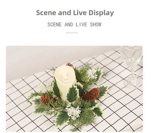 Close-up of LED candle surrounded by pine cones and holly leaves on a festive table