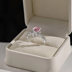 Close-up of S925 silver ring featuring pink heart zircon and floral side accents