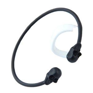 Minimalist black skull open cuff bracelet in matte metal finish with a white accessory
