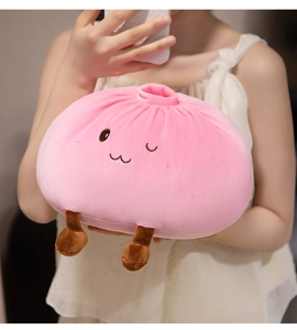 Close-up of soft pink steamed bun plush toy with cute facial expression and small legs