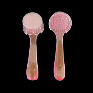 Detailed view of pink transparent manicure dust brushes with protective cover and soft bristles