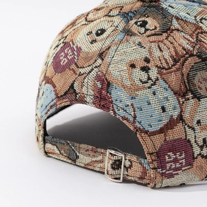 Close-up of the vintage knitted baseball cap with metal buckle and cute puppy patterns