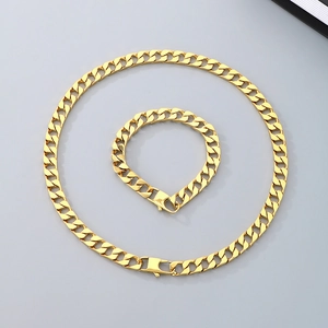 Polished gold Cuban link chain necklace and bracelet set for men with a flat link design