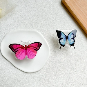 Detail of rose red and light blue acrylic butterfly cell phone socket stands