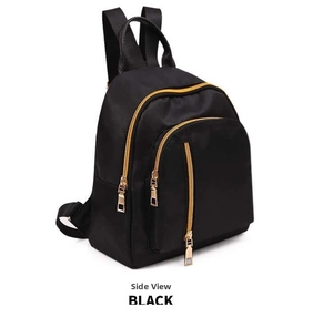 Side view of a mini black nylon backpack featuring gold metal zippers and side pocket
