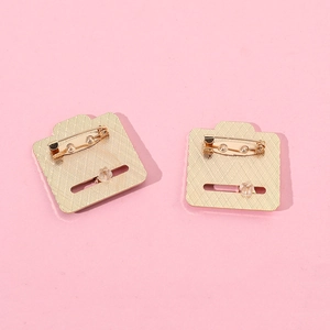 Creative social mood slider enamel pin in golden metal finish on pink background