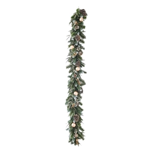 Christmas garland with flocked snow needles, golden baubles, and natural pinecones on white background
