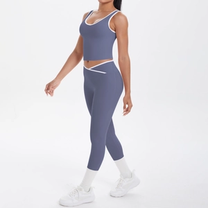 Detail of high waist yoga set in misty blue with white contrast trim on the leggings
