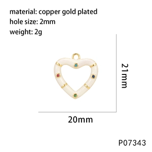Macro view of macaron heart pendant with colorful zircons and copper gold plating