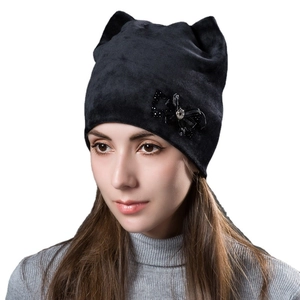 Women's black velvet cat ear beanie with bow and rhinestone detail for winter warmth