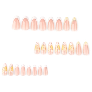 French almond fake nails set with nude pink base, white tips and small yellow daisies
