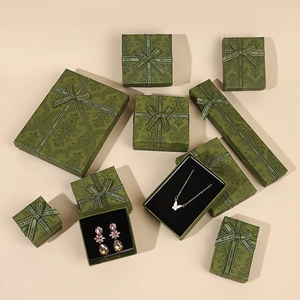 Vintage green jewelry gift boxes with ribbons for rings and necklaces set
