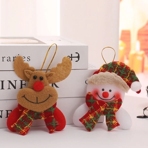 Detail of felt Christmas ornaments featuring a brown reindeer and snowman with plaid scarves