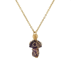 Macro detail of purple crystal mushroom pendant wrapped in golden wire on a fine gold chain
