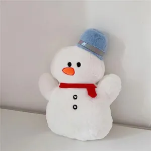 Close-up of plush snowman toy with red scarf and blue hat showing soft texture