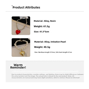 Detailed view of red resin heart pendant and pearl chain with size and weight specs