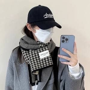 Classic black and white houndstooth knitted scarf with stylish winter outfit outfit