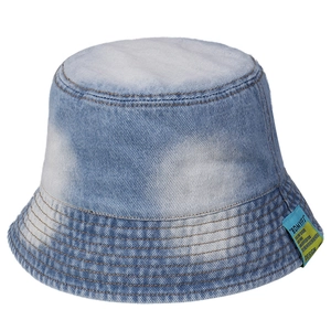 Light blue washed denim bucket hat with decorative patch and wide stitched brim