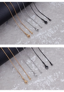 Detailed view of 1mm stainless steel snake chains in gold, silver, and black with lobster clasps