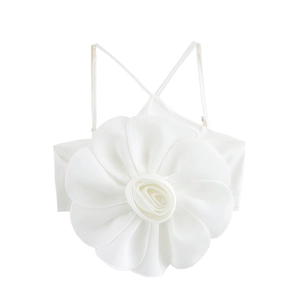 Detail view of white camellia camisole top with 3D floral accent and thin straps