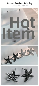 Detailed macro view of starfish stud earrings with silver and black AAA zircon micro-paving
