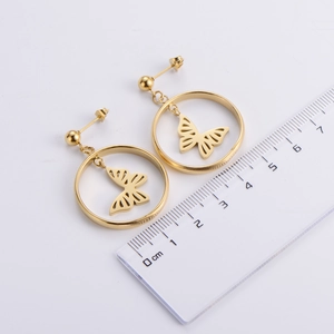 Detailed view of gold hollow butterfly hoop earrings with ruler showing 2.5cm diameter
