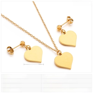 Detail view of gold stainless steel heart necklace and earrings set with measurements