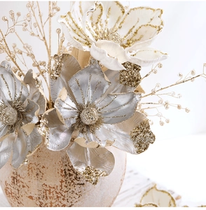 Macro detail of silver artificial flower petals with gold glitter edges for Christmas