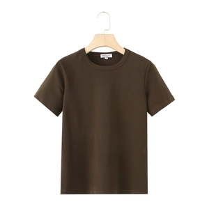 Close-up of dark brown crew neck T-shirt on a wooden hanger showing fabric and neckline