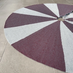 Detail of 48-inch knitted Christmas tree skirt with burgundy and grey striped pattern