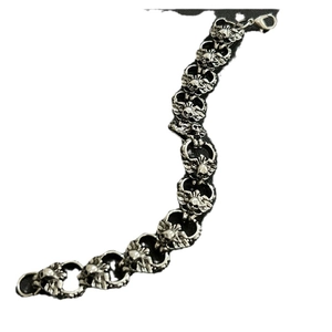 Retro silver hip-hop bracelet featuring detailed skull and wing links with lobster clasp