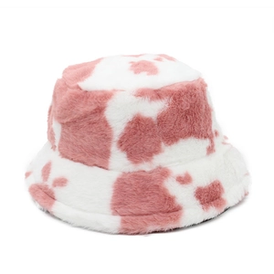 Close-up of the soft pink cow print faux fur texture on a warm winter bucket hat