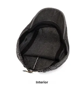 Detail view of washed canvas beret featuring adjustable metal buckle and inner sweatband